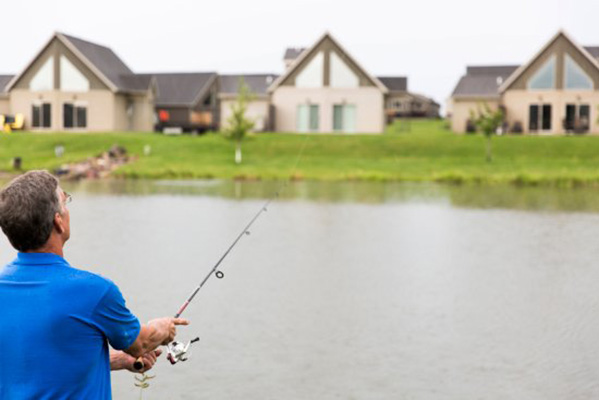 Man fishing in the fishing pond at Bridges Bay Resort